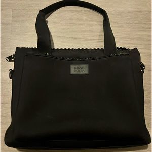 Dagne Dover laptop bag. Has multiple compartments and back slip for luggage.
